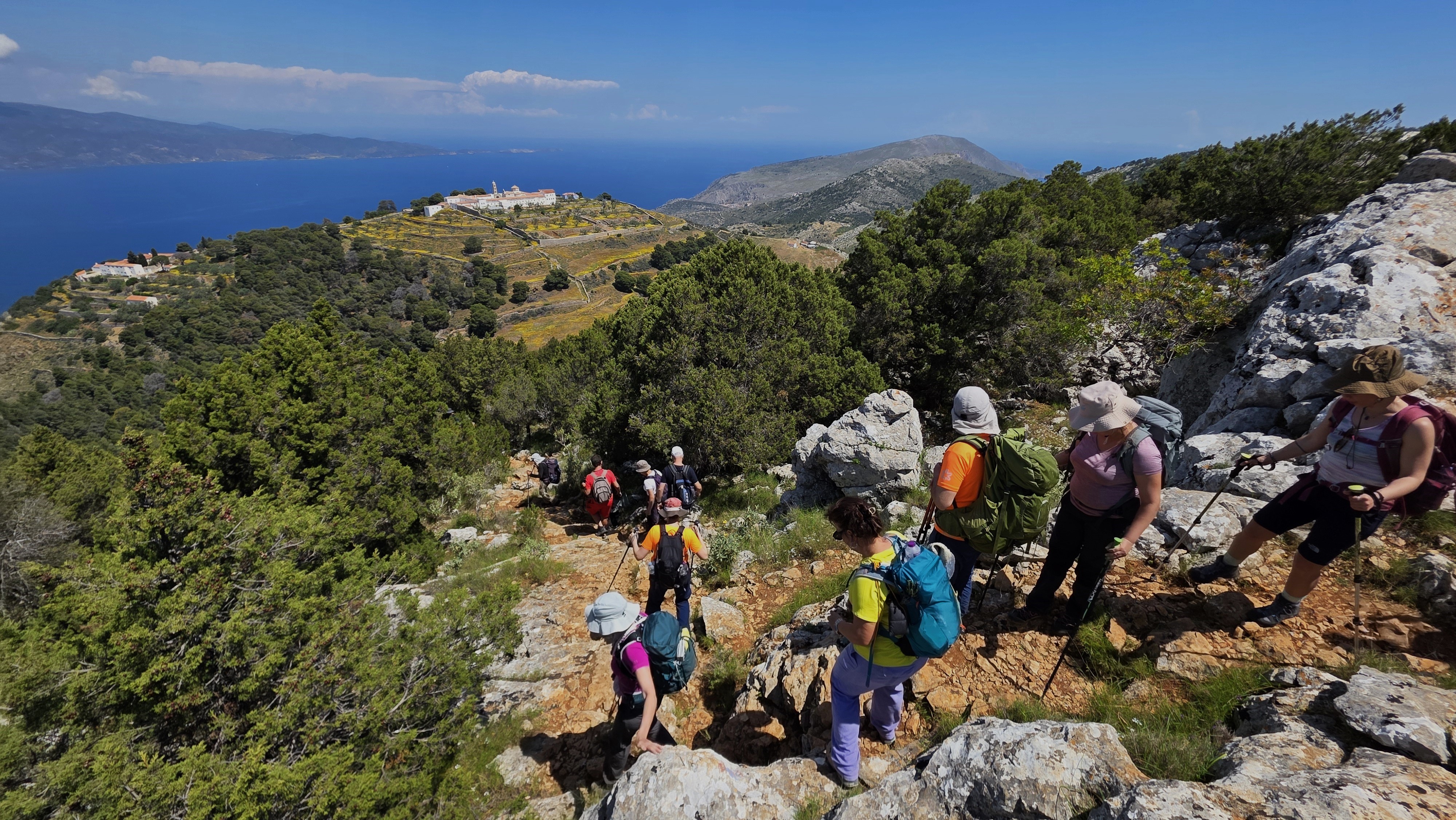 Rocky cliff path above the Aegean sea on Hydra island